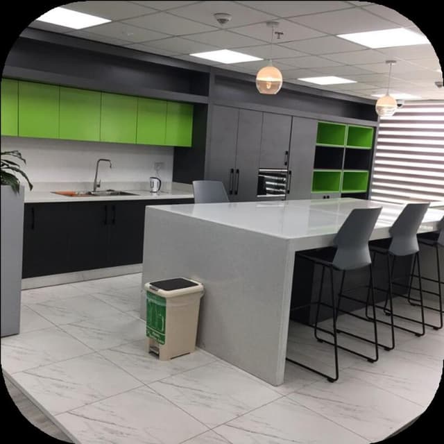 Remodelled office breakroom with cabinetry and seating