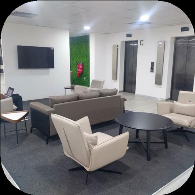 Corporate office with branded feature wall and workstations
