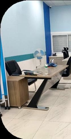 Office workstation area with desks and equipment