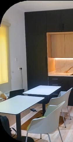Modern office kitchen with cabinetry and appliances